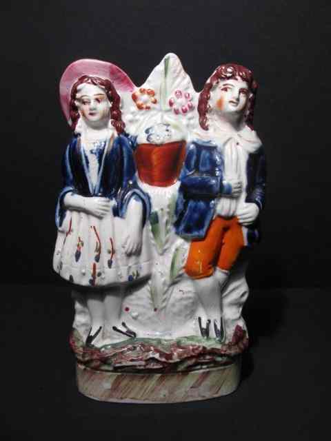 Appraisal: th century English Staffordshire figurine depicting figures Measures '' tall