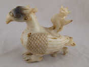 Appraisal: A white jade mythical bird container the lid a similar