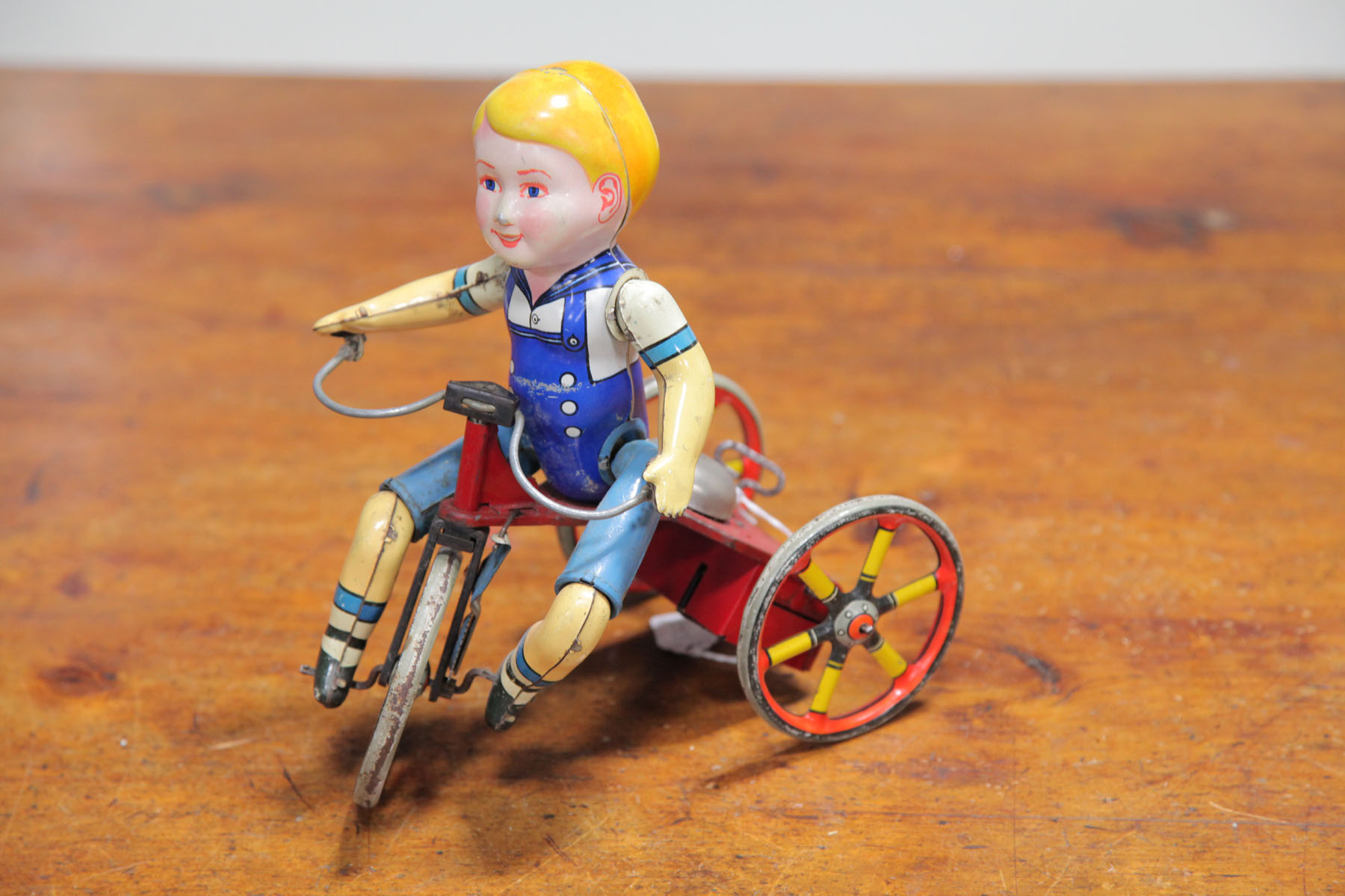 Appraisal: BOY ON TRICYCLE WIND-UP First half of th century unmarked