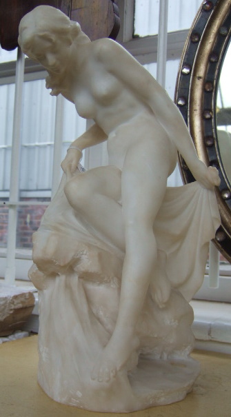 Appraisal: A white alabaster sculpture of a nude lady early th