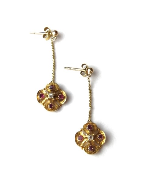 Appraisal: A pair of gold ruby and diamond set pendant earrings