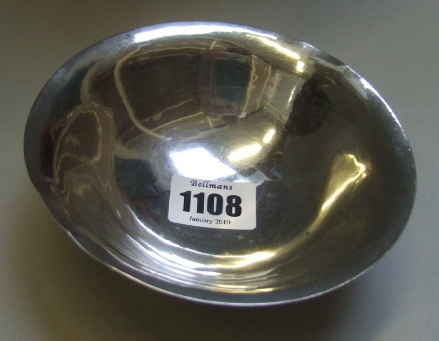 Appraisal: A silver circular bowl by Georg Jensen on a circular