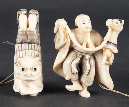 Appraisal: Two Japanese carved ivory netsukes dancer in lion mask and