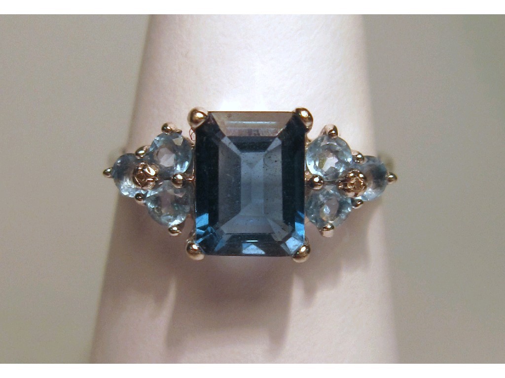 Appraisal: Nine carat white gold blue topaz and diamond set dress