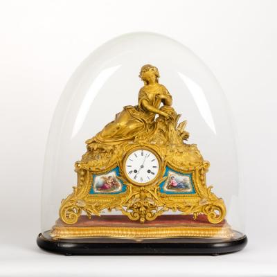 Appraisal: A Napoleon III ormolu and porcelain mounted eight-day mantel clock