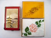 Appraisal: A musical combined cigarette case and compact and two enamelled