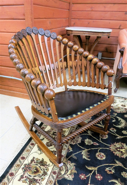 Appraisal: AN OAK 'LOLLIPOP' ROCKING CHAIR in the manner of George