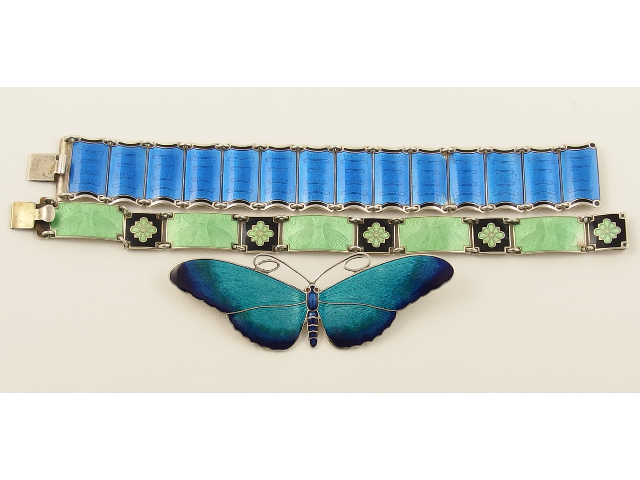 Appraisal: An enamelled butterfly brooch by Marius Hammer together with two