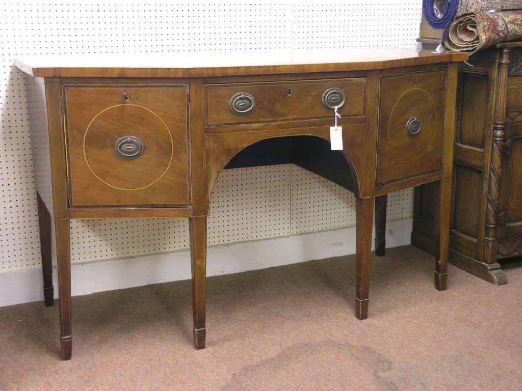 Appraisal: An Edwardian inlaid mahogany sideboard angular-fronted with single drawer flanked