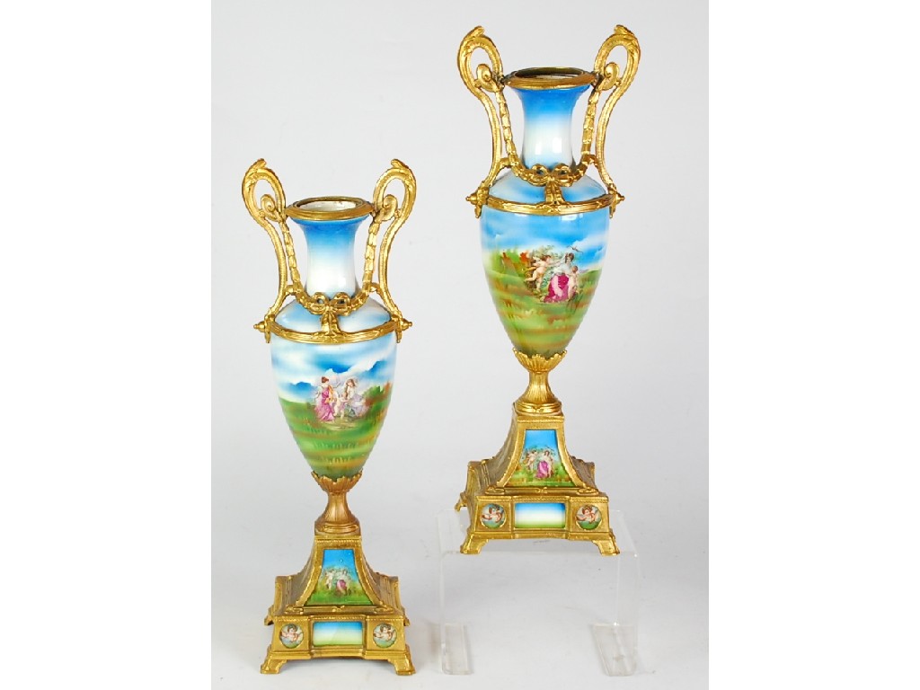 Appraisal: PAIR OF FOREIGN GILT METAL MOUNTED TWO HANDLED PORCELAIN PEDESTAL