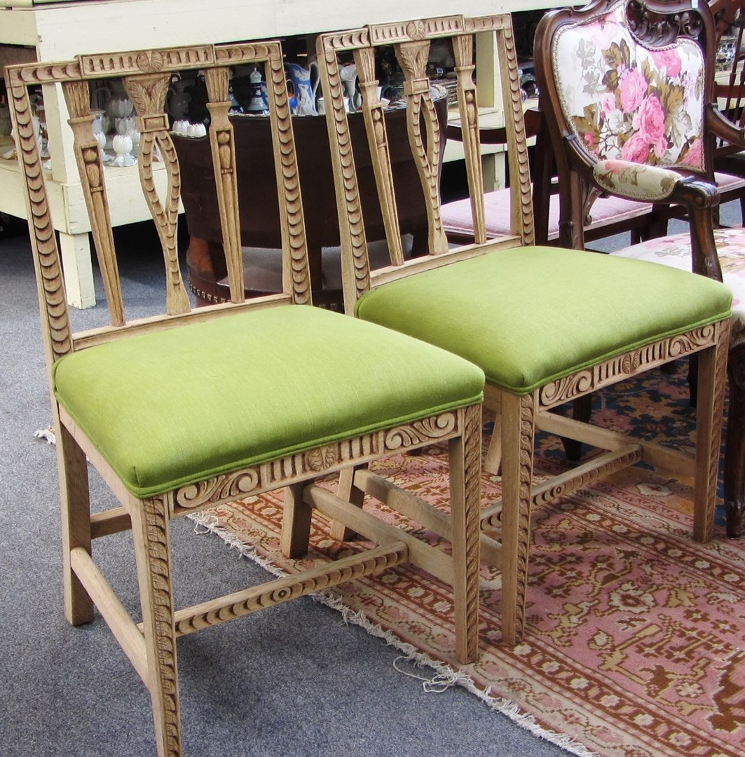 Appraisal: A pair of George III bleached oak square backed dining