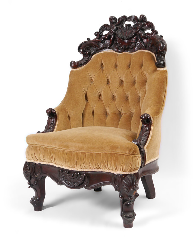 Appraisal: CARVED VICTORIAN CHAIR WITH CHERUBS Profusely carved back crest with