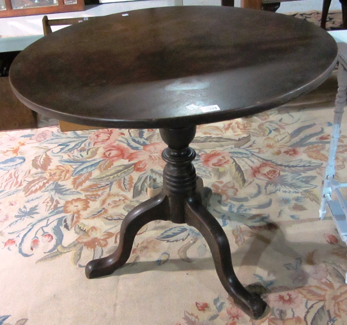 Appraisal: A th century mahogany circular tripod occasional table