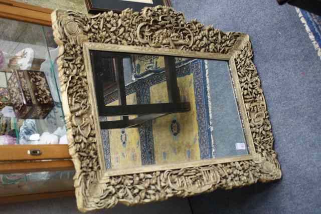 Appraisal: A CHINESE IVORY COLOURED CARVED WOODEN HANGING WALL MIRROR with