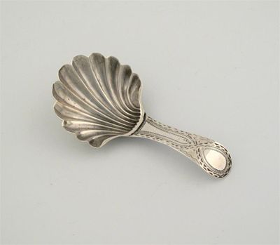 Appraisal: A George III spoon with fluted bowl and bright-cut handle