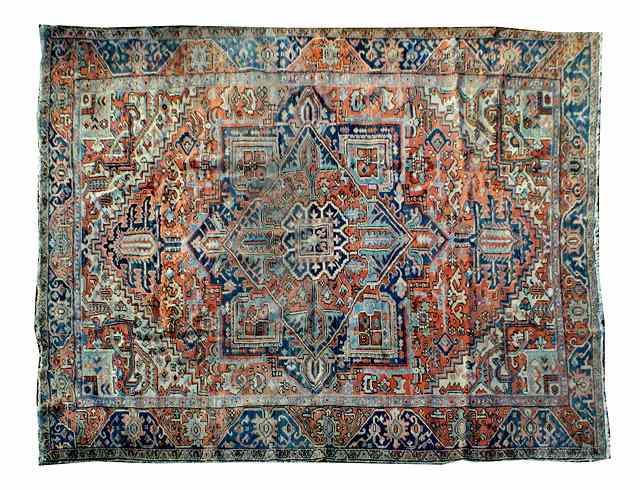 Appraisal: AN HEREZ RUST GROUND CARPET with stylised geometric decoration in