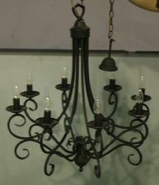 Appraisal: A wrought metal eight-light chandelier