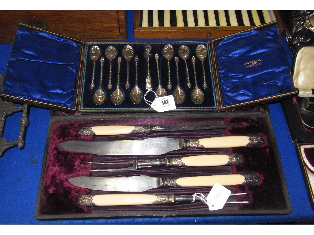 Appraisal: Lot comprising cased five piece carving set and cased spoon