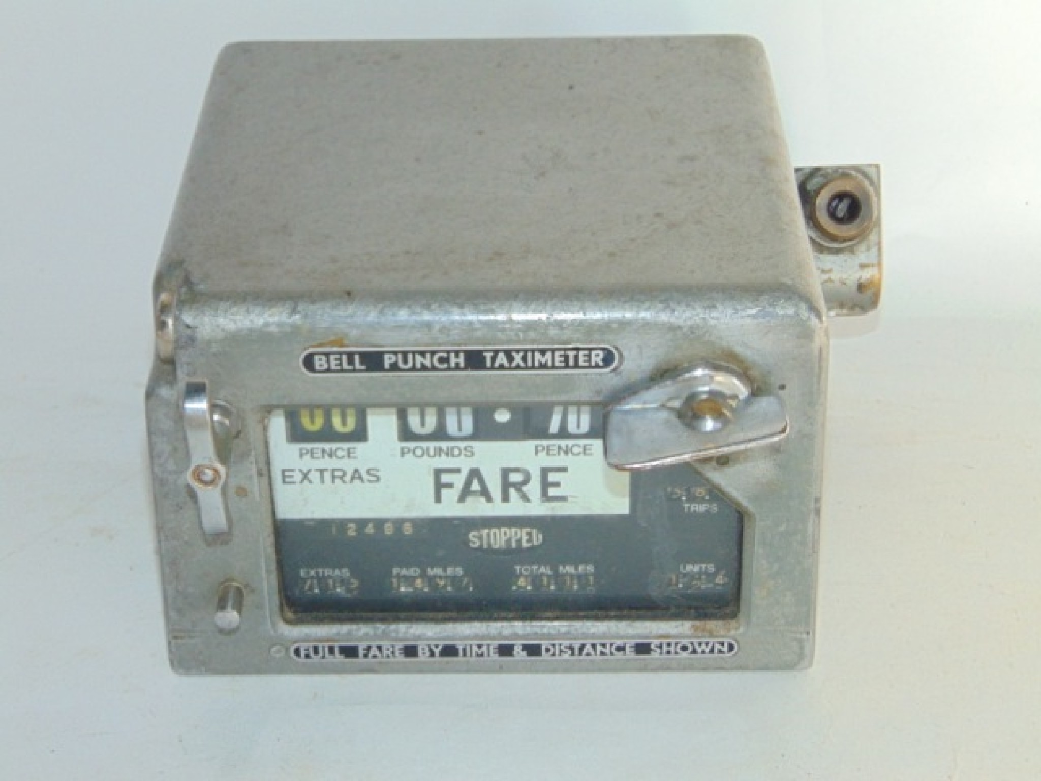 Appraisal: A th century Bell Punch Taximeter with fare aperture in