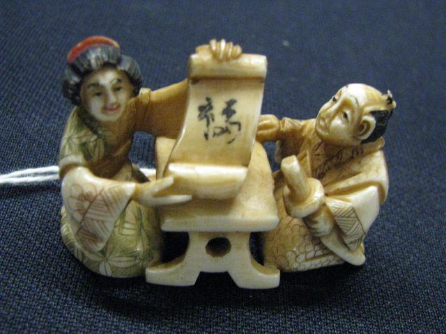 Appraisal: Carved Ivory Netsuke of Man Woman at table fine polychrome