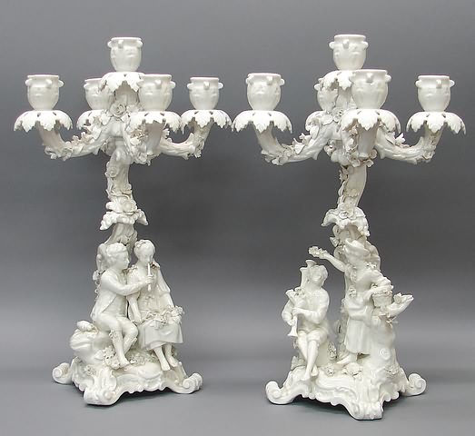 Appraisal: Rococo design each with branches lights and couple on scrolled