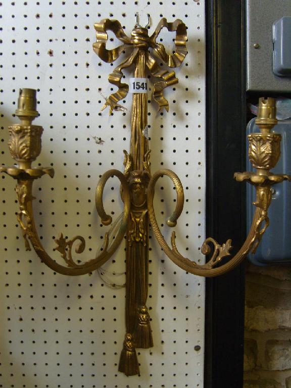 Appraisal: A pair of brass -branch wall lights with ribboned tasselled