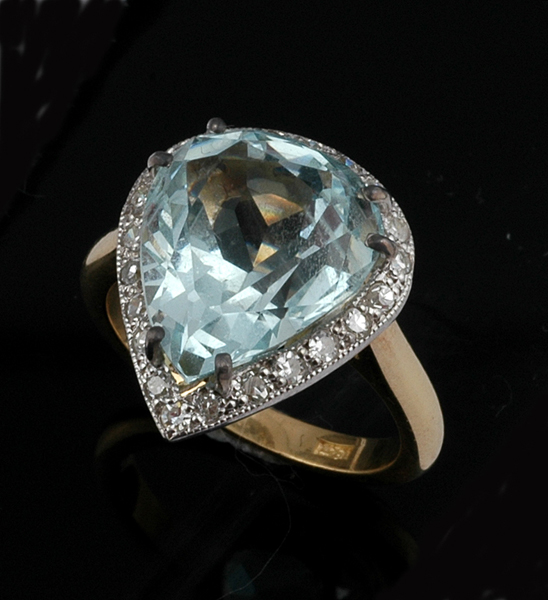 Appraisal: AN AQUAMARINE AND DIAMOND RING The pear cut aquamarine weighing