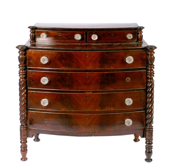 Appraisal: An American chest of drawers with glass handles height in