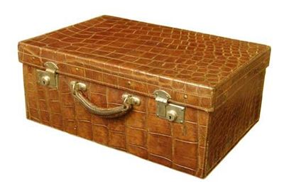 Appraisal: A crocodile suitcase with a pocketed fabric interior and leather