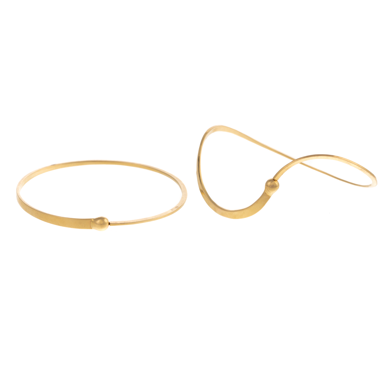 Appraisal: TWO FREEFORM K YELLOW GOLD BANGLES K yellow gold oval