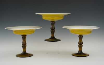 Appraisal: Three Empoli Italian Cased Glass Compotes Alabaster and amber cased