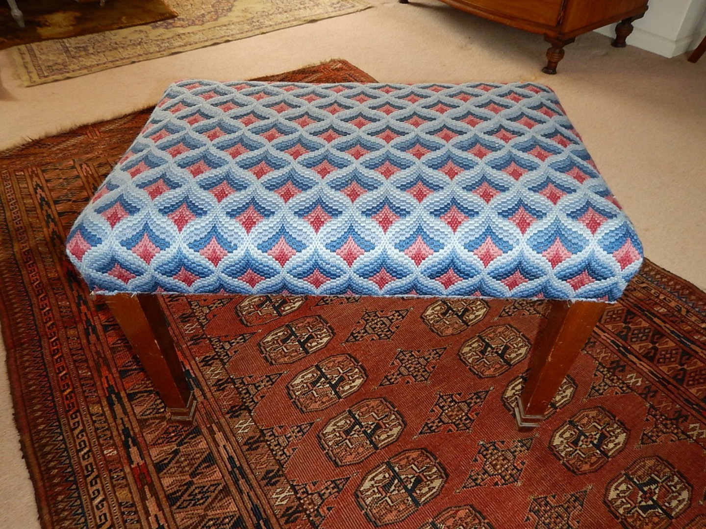 Appraisal: A mahogany dressing stool with over upholstered needlework seat on