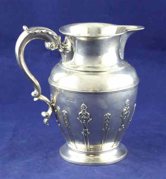 Appraisal: A late Victorian silver jug of baluster form with strapwork