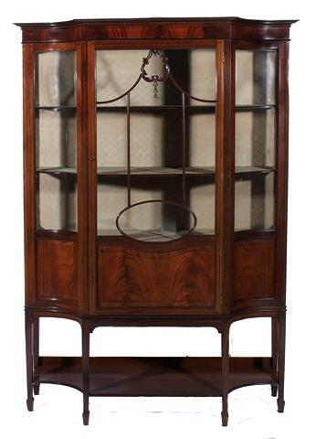 Appraisal: A LARGE EDWARDIAN MAHOGANY AND INLAID DISPLAY CABINET with shaped