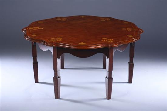 Appraisal: INLAID SIX-LEG LOW TABLE Circa attributed to Wylie Lochhead Shaped