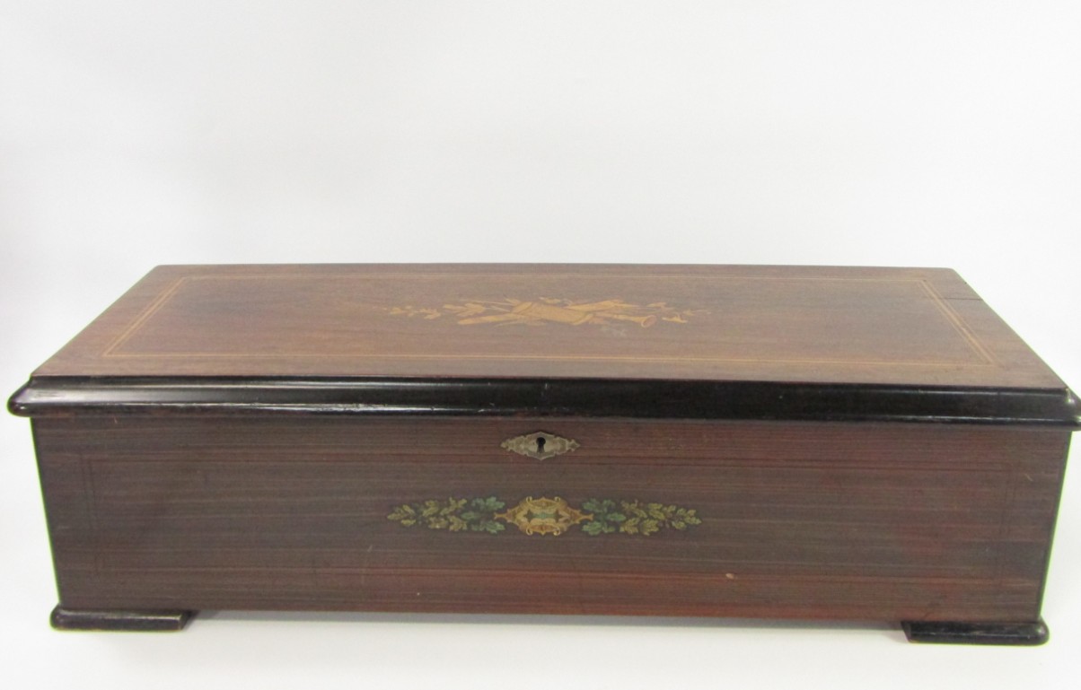 Appraisal: A Swiss walnut ebonised and inlaid music box late thC