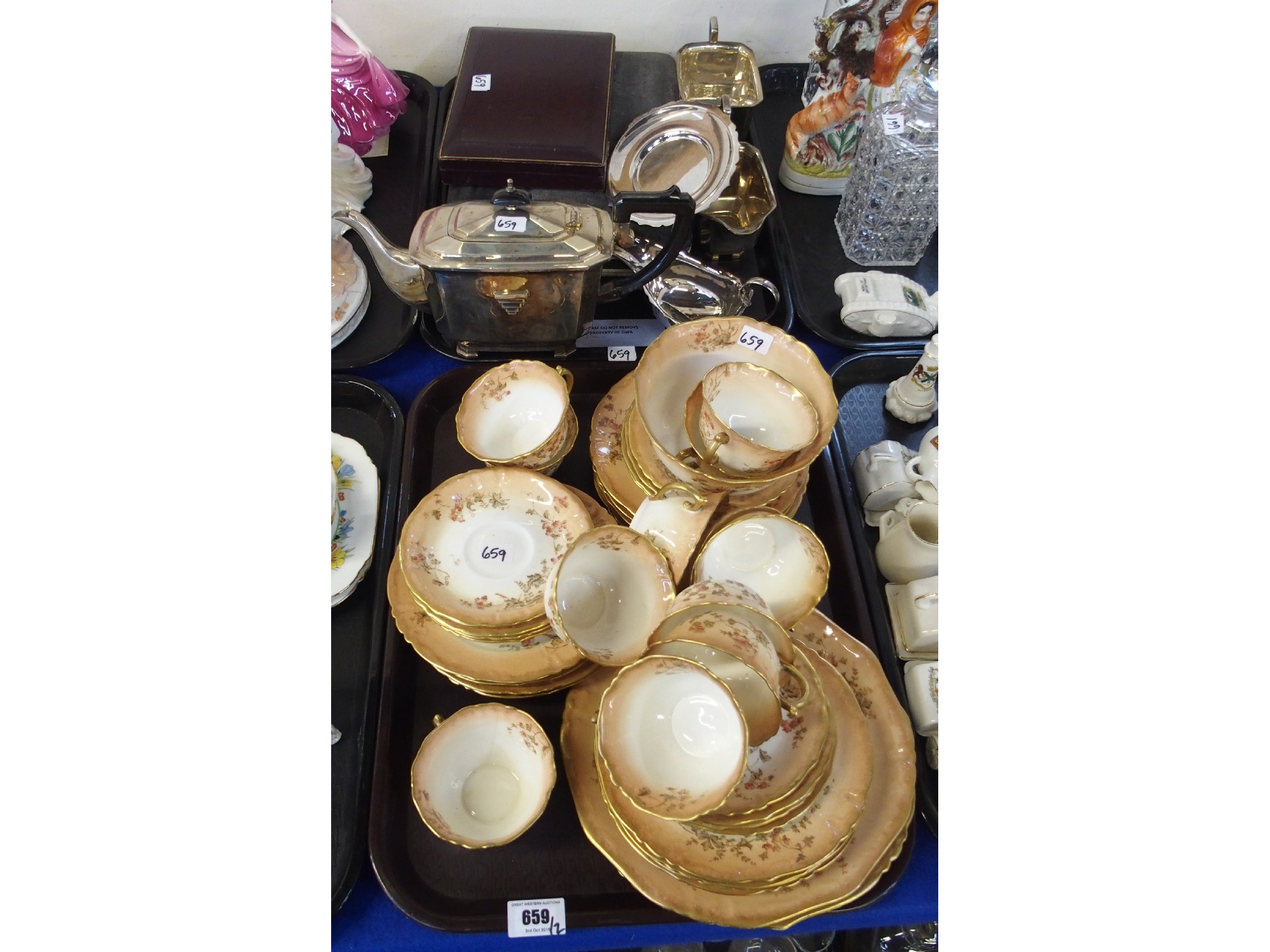 Appraisal: Two trays comprising a Continental porcelain parcel gilt tea set