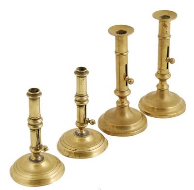 Appraisal: A pair of George III brass candlesticks raised on a