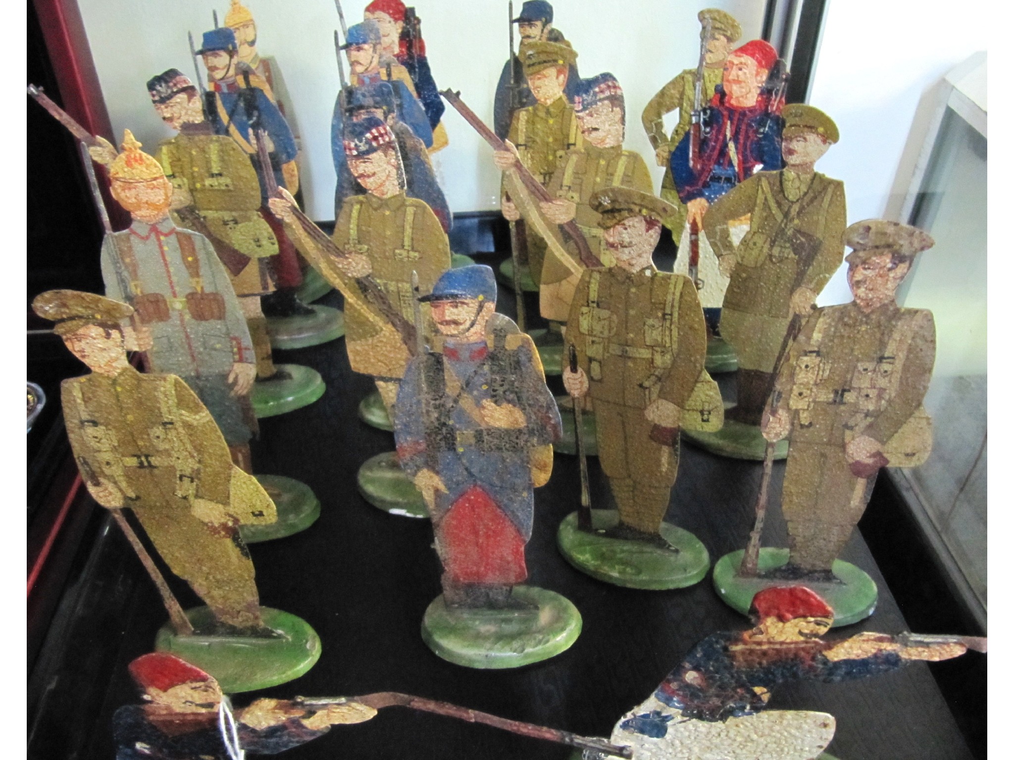 Appraisal: A group of twenty flat metal soldier figures probably Kiezer