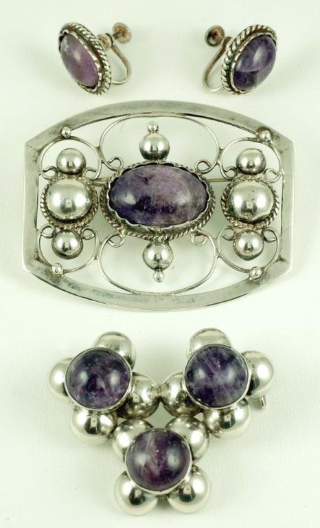 Appraisal: Two Mexican silver brooches with amethyst cabochon stones One in