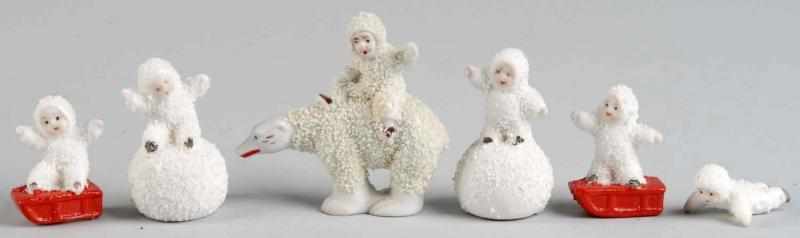 Appraisal: Lot of Porcelain Snowbabies Description Includes two standing on a