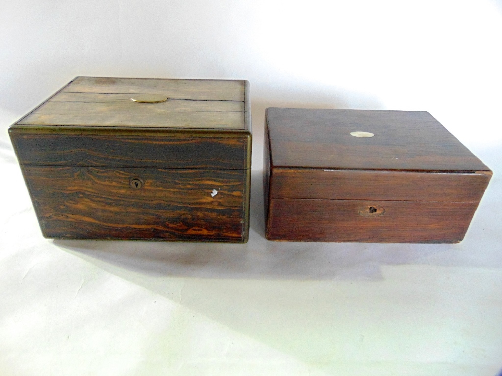 Appraisal: A Victorian rosewood veneered vanity box with applied brass bordering