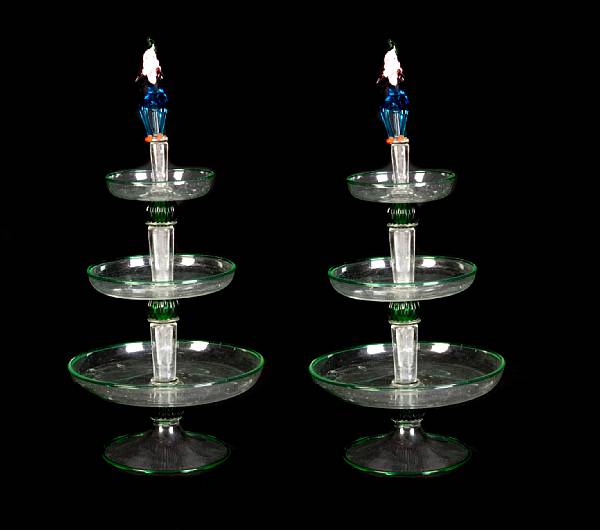 Appraisal: A pair of Venetian glass epergnes with figural finials height