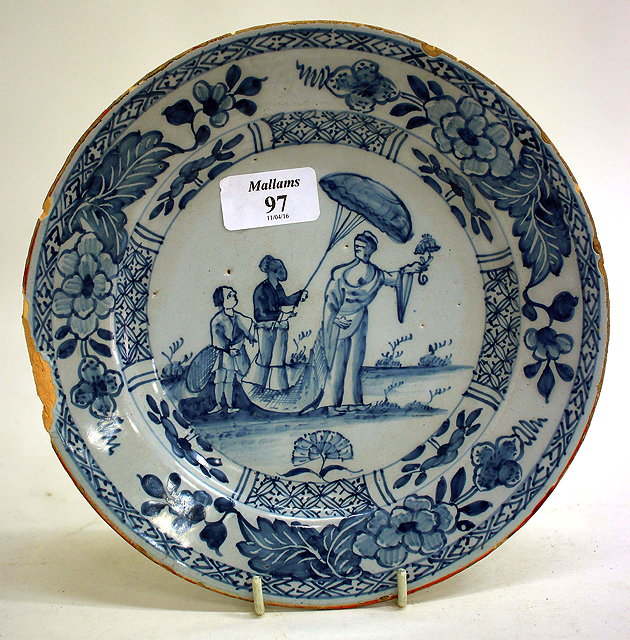 Appraisal: AN ANTIQUE BLUE AND WHITE DELFTWARE PLATE decorated with figures