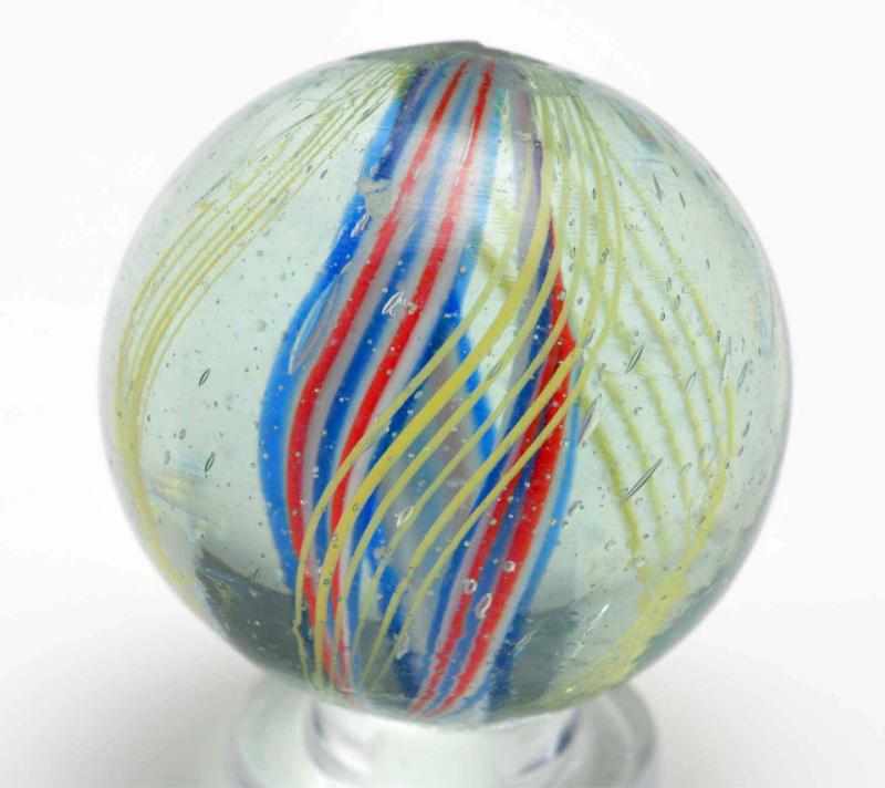 Appraisal: Divided Core Swirl Marble Description Outer sets of yellow latticino