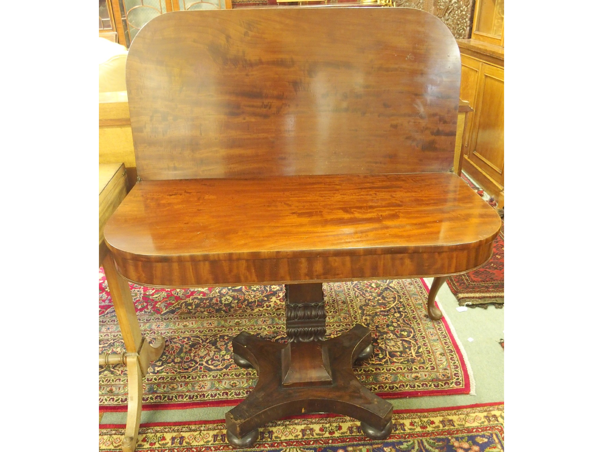 Appraisal: A Victorian mahogany fold over tea table