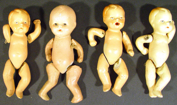 Appraisal: Four German china and composite miniature dolls with jointed bodies