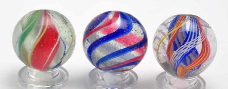 Appraisal: Lot of Divided Core Swirl Marbles Description Includes three multicolored