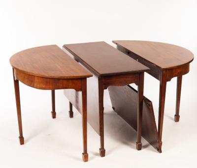 Appraisal: A George III mahogany D-end extending dining table the central