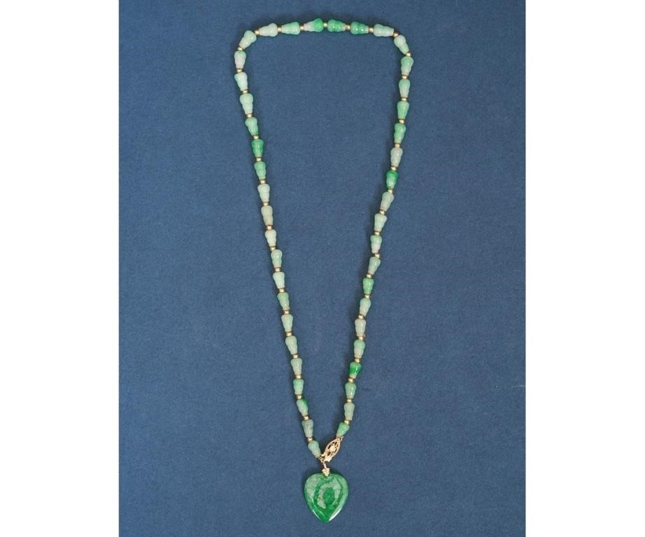 Appraisal: Chinese green jadite necklace with pendant Pendant x l overall